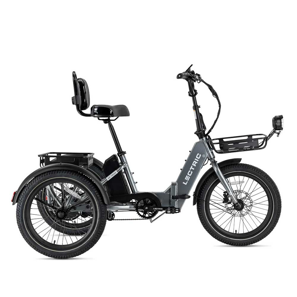 A black Lectric eTrike with a step-through frame, rear and front cargo racks, thick tires, and a cushioned seat with a backrest. The brand name "Lectric" is displayed on the frame.