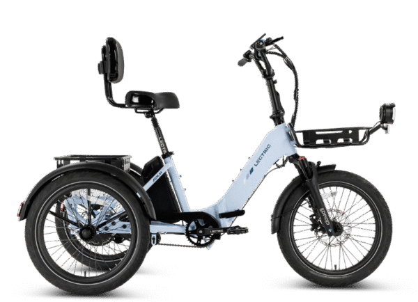 A light blue electric tricycle with a black seat, high backrest, front basket, and rear cargo rack, shown from the side on a white background.