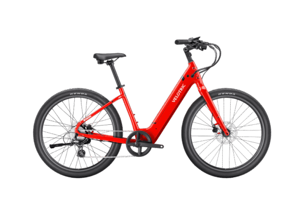 A bright red electric bicycle with a step-through frame, black saddle, black handlebars, and thick black tires, displayed on a plain white background. The brand name "Velotric" is visible on the frame.